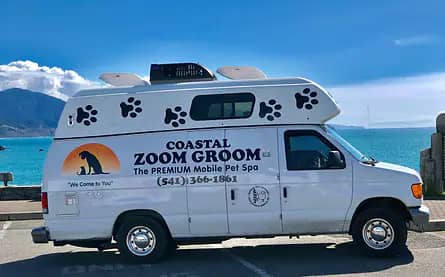 Coastal Zoom Groom mobile grooming van on the Oregon coast